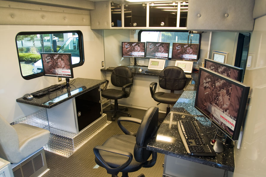 Photo of the interior of a rolling office for a oil well drilling company.
